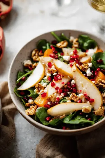 winter salad with pears, pomegranates, and walnuts